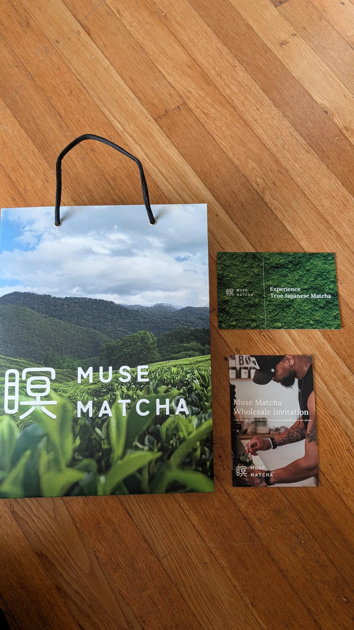 Bag and wholesale cards on a wood floor